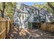 Multi-level backyard featuring privacy fence and brick border surrounding the house at 1022 Mariners Ct, Stone Mountain, GA 30083