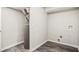 Unfinished basement with a hot water heater and connections for a washer and dryer at 1022 Mariners Ct, Stone Mountain, GA 30083