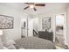 Cozy bedroom featuring a grey quilt, modern decor, and access to the bathroom and closet at 1022 Mariners Ct, Stone Mountain, GA 30083