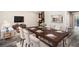 An inviting dining room area with seating for six and an open view to the living room at 1022 Mariners Ct, Stone Mountain, GA 30083