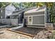 Gray townhome with a quaint fenced-in entrance leading to a cozy walkway at 1022 Mariners Ct, Stone Mountain, GA 30083
