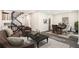 Inviting living room with modern furnishings, wood floors, and a view into the dining area at 1022 Mariners Ct, Stone Mountain, GA 30083