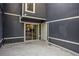 A cozy outdoor patio with a sliding door and a white door to enter into the house at 1022 Mariners Ct, Stone Mountain, GA 30083