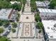 Aerial view of a town square with a fountain, trees, and landscaping at 201 W Ponce De Leon Ave # 402, Decatur, GA 30030