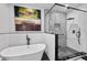A luxurious bathroom features a modern soaking tub and a sleek glass-enclosed shower with patterned tile at 201 W Ponce De Leon Ave # 402, Decatur, GA 30030