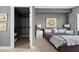 Bedroom with a comfortable bed, a walk-in closet and an ornate picture that adds style and sophistication at 201 W Ponce De Leon Ave # 402, Decatur, GA 30030