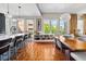This well-lit space features wood floors, a modern light fixture, and an open floor plan leading to the gourmet kitchen at 201 W Ponce De Leon Ave # 402, Decatur, GA 30030