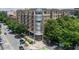 Beautiful condo building with street view, lush trees and manicured landscaping with upscale exterior and walkable sidewalks at 201 W Ponce De Leon Ave # 402, Decatur, GA 30030