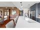 This modern kitchen boasts gray cabinets, stainless steel appliances, a long island, and hardwood floors throughout at 201 W Ponce De Leon Ave # 402, Decatur, GA 30030