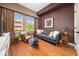 Cozy living room with hardwood floors, lots of natural light, and comfortable seating arrangement at 201 W Ponce De Leon Ave # 402, Decatur, GA 30030