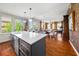 Bright, open-concept living space features a modern kitchen, adjacent dining area, and comfortable living area with many windows at 201 W Ponce De Leon Ave # 402, Decatur, GA 30030