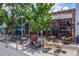 Restaurant patio with outdoor seating and lush greenery, perfect for enjoying a meal at 201 W Ponce De Leon Ave # 402, Decatur, GA 30030