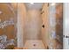 Walk-in shower with neutral tile and zebra patterned glass door at 201 W Ponce De Leon Ave # 402, Decatur, GA 30030