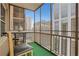 Charming screened balcony with views of the city skyline, perfect for outdoor relaxation at 300 Peachtree Ne St # 22N, Atlanta, GA 30308
