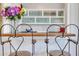 Kitchen bar seating with decorative shelving, and stylish chairs at 300 Peachtree Ne St # 22N, Atlanta, GA 30308