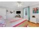 Inviting bedroom with large windows, art, TV, and a comfortable queen-sized bed at 300 Peachtree Ne St # 22N, Atlanta, GA 30308