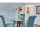 Cozy dining area with a glass table and seating for three, perfect for intimate meals at 300 Peachtree Ne St # 22N, Atlanta, GA 30308