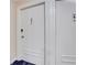 Hallway view of a white apartment door in a modern apartment complex at 300 Peachtree Ne St # 22N, Atlanta, GA 30308