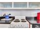 Clean kitchen featuring white range, cabinets, and black countertops at 300 Peachtree Ne St # 22N, Atlanta, GA 30308
