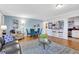 Open living room featuring stylish seating, wood floors, and a modern, bright kitchen at 300 Peachtree Ne St # 22N, Atlanta, GA 30308