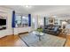 Bright living room with modern decor, hardwood floors, and a stylish blue accent rug at 300 Peachtree Ne St # 22N, Atlanta, GA 30308
