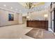 A welcoming lobby featuring a reception desk, recessed ceiling lighting, and 'Peachtree Towers' entrance mat at 300 Peachtree Ne St # 22N, Atlanta, GA 30308