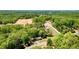 Beautiful aerial view of the home nestled among lush green trees at 4265 Hurt Bridge Rd, Cumming, GA 30028