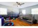 ' bedroom with a bunk bed, hardwood floors, and a mountain-themed accent wall at 4265 Hurt Bridge Rd, Cumming, GA 30028
