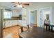 Bright kitchen open to the living area, featuring modern appliances, wooden floors and ample counter space, perfect for cooking at 4265 Hurt Bridge Rd, Cumming, GA 30028