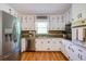 Efficient kitchen featuring stainless appliances, white cabinets, and granite countertops offering a clean, organized space at 4265 Hurt Bridge Rd, Cumming, GA 30028