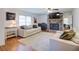 Inviting living room with hardwood floors, a cozy fireplace, and stylish decor, perfect for relaxing and entertaining at 4265 Hurt Bridge Rd, Cumming, GA 30028