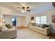 Spacious living area with shiplap walls, a large rug, and ample seating, creating a comfortable and welcoming atmosphere at 4265 Hurt Bridge Rd, Cumming, GA 30028
