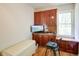 Office with built-in desk and cabinets, a window with natural light, and hardwood floors at 4265 Hurt Bridge Rd, Cumming, GA 30028