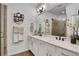 Bright bathroom featuring double vanity, quartz countertop, bronze fixtures, and large mirror at 758 Cady Way, Atlanta, GA 30312