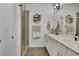 Modern bathroom featuring double vanity, glass-enclosed shower, and stylish tile flooring at 758 Cady Way, Atlanta, GA 30312