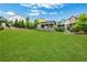 Large community greenspace featuring a lush lawn, mature trees, and an outdoor lounge area at 758 Cady Way, Atlanta, GA 30312