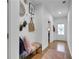 Inviting entryway featuring hardwood floors, a colorful bench, and decorative wall art at 758 Cady Way, Atlanta, GA 30312
