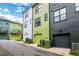 Exterior shot of multi-colored townhomes with garages and professionally landscaped front yards at 758 Cady Way, Atlanta, GA 30312