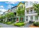Street view of townhomes with unique colorful exteriors, porches and landscaping at 758 Cady Way, Atlanta, GA 30312