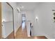 Bright upstairs hallway featuring wood floors, barn door, and view into bedroom at 758 Cady Way, Atlanta, GA 30312