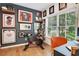 Bright home gym featuring a Peloton bike, natural light and walls adorned with sports memorabilia at 758 Cady Way, Atlanta, GA 30312