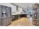 Well-equipped kitchen featuring stainless steel appliances, a bar area, and open layout at 758 Cady Way, Atlanta, GA 30312