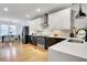 Contemporary kitchen featuring stainless steel appliances, sleek countertops, and a dining area at 758 Cady Way, Atlanta, GA 30312