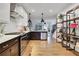 Stylish kitchen with stainless steel appliances, dark lower cabinets, and hardwood flooring at 758 Cady Way, Atlanta, GA 30312