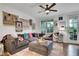 Comfortable living room with a large sectional sofa, plush ottoman, and decorative accents at 758 Cady Way, Atlanta, GA 30312