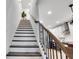 Elegant staircase with wooden treads, white risers, and modern railing leading to the upper level at 758 Cady Way, Atlanta, GA 30312