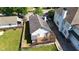 Birds eye view of home showcasing backyard deck with pergola and privacy fence at 77 Glenn Se St, Atlanta, GA 30312