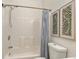 Bathroom with shower and tub, modern fixtures, white tile and decorative art at 77 Glenn Se St, Atlanta, GA 30312