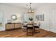 Bright dining room featuring wood floors, modern chandelier, and stylish furnishings at 77 Glenn Se St, Atlanta, GA 30312