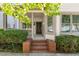 Inviting front entrance with brick steps and a covered porch, perfect for relaxing at 77 Glenn Se St, Atlanta, GA 30312